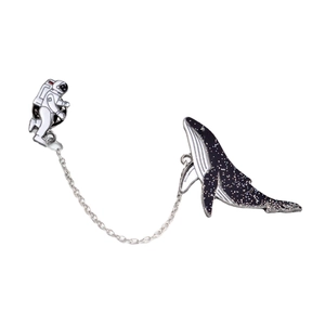 Creative astronaut and space whale enamel brooch with metal chain on white background