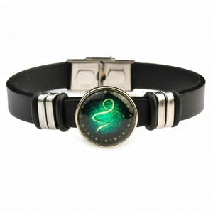 Adjustable black silicone bracelet with stainless steel zodiac charm and green spiral galaxy