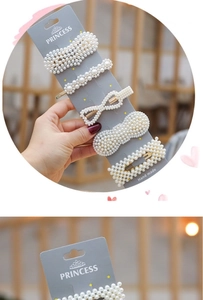 Close-up of five white pearl hair clip sets on a display card for women accessories