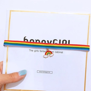Close-up of a colorful rainbow choker bracelet with a drip oil alloy cloud charm