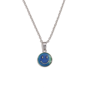 Silver necklace with color-changing butterfly pendant and minimalist smiley face symbol