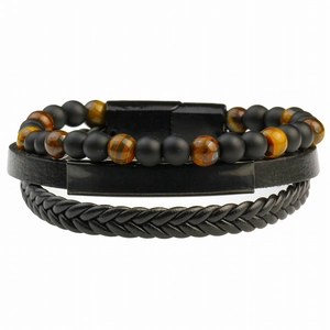Detail of men's multilayer bracelet featuring tiger eye beads and braided black leather