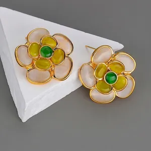 Elegant 18K gold flower earrings with green gemstone and opal petals on stone base