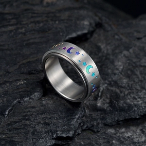 Rotating stainless steel spinner ring with iridescent moon star pattern on black stone