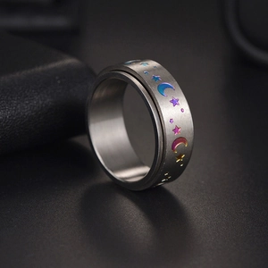 8mm spinner ring with colorful moon and star patterns on brushed titanium steel band