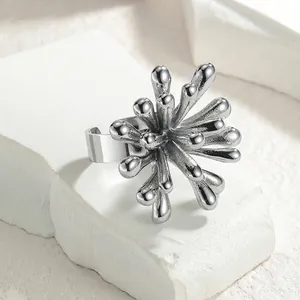 Detailed view of silver sunflower open ring with unique textured petals on stone base