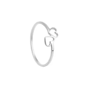 Detailed macro shot of silver hollow double heart stainless steel minimalist ring