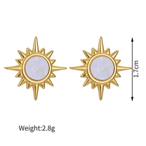 Detail of starburst earrings in gold finish with purple gemstone, 1.7cm size