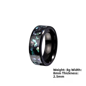 Detail view of 8mm wide black titanium galaxy ring with colorful opal inlay