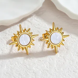 Minimalist gold starburst sun stud earrings with mother of pearl inlay on white stone