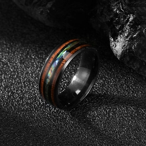 Vintage stainless steel ring with black base, wood inlay, and colorful abalone shell shell