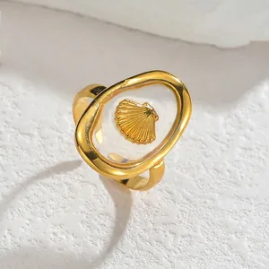 Minimalist gold stainless steel open ring with oval shell inlay on textured white stone
