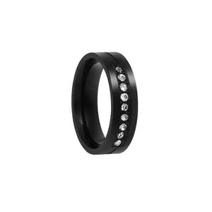 Detail of 6mm black stainless steel ring featuring ten inlaid round cubic zirconia stones