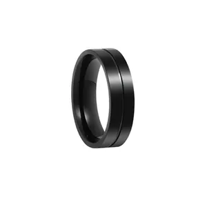 Detailed close-up of a 6mm black stainless steel ring with a central decorative groove