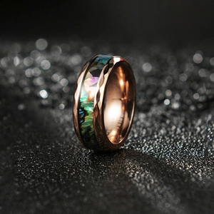 Rose gold tungsten ring with hammered edges and vibrant inlaid abalone shell band