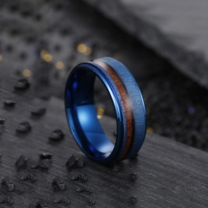 Men's blue brushed stainless steel ring with elegant mahogany wood inlay on black rock