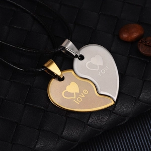 Couples' stainless steel heart necklace set in gold and silver finish with love engraving