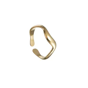Detailed close-up of a gold irregular wave ring showing polished finish and adjustable opening