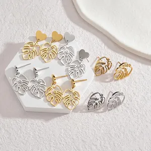 Minimalist hollow Monstera leaf drop earrings in gold and silver stainless steel