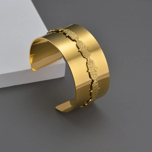 Polished 18K gold plated wide cuff bracelet with textured oval link relief