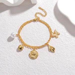 Double-layered golden stainless steel bracelet with butterfly tassel and pearl charms