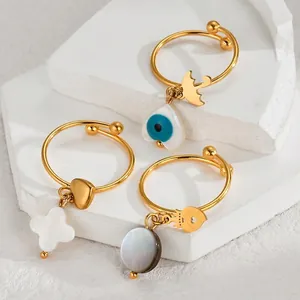 Three-piece bohemian adjustable ring set with heart and shell charms in gold finish
