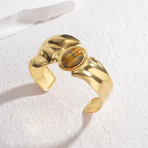 Vintage irregular gold cuff bracelet with oval tiger's eye stone for a luxury look
