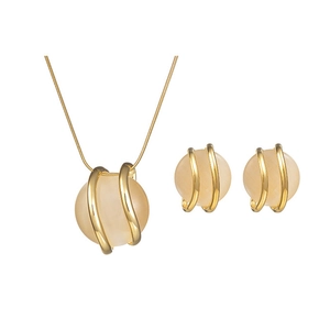 Minimalist gold circle pendant necklace and earrings set with elegant white opal stones