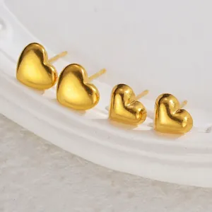 Set of two polished heart-shaped stainless steel earrings in gold-tone finish
