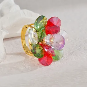 Detail of colorful crystal flower ring with pear-cut petals and adjustable gold band