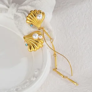 Elegant asymmetrical shell earrings with pearls and blue rhinestones in gold titanium steel