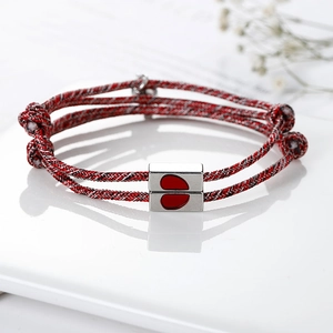 Magnetic couples bracelets with red woven cord and silver heart magnet clasps