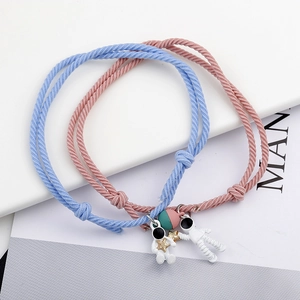 Astronaut magnetic couple bracelets in pink and blue woven cords for best friends gift