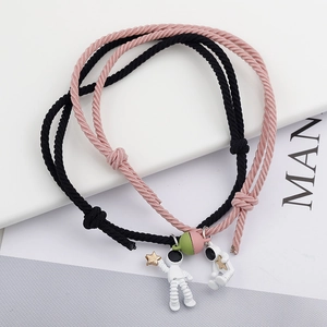 Matching astronaut couple bracelets with magnetic charm and adjustable woven ropes