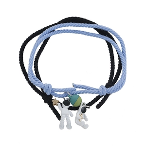 Astronaut couple bracelets with blue and black braided ropes and star pendants