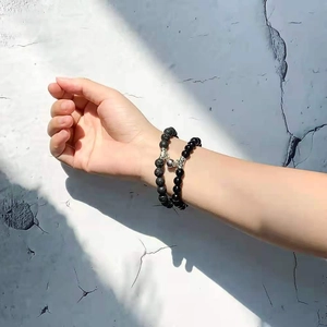 Matching magnetic heart bracelets for couples with black lava stone and polished beads