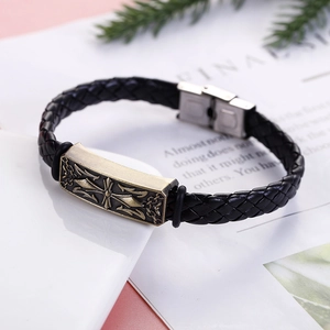 Men's vintage braided leather bracelet with bronze cross relief and steel clasp