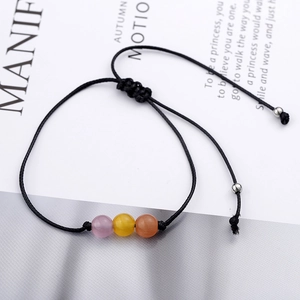 Handmade woven cord bracelet with colorful cat eye beads and adjustable drawstring