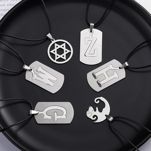 Unisex stainless steel initial and star pendants with matte finish on black wax cords
