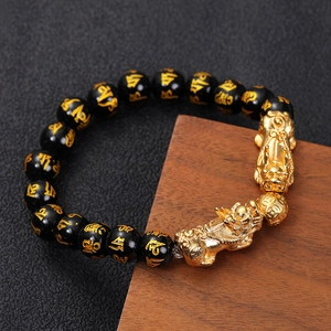 Golden Pi Xiu obsidian bracelet featuring black beads with gold Six-Syllable Mantra carvings
