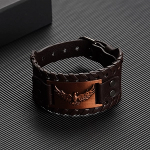 Vintage dark brown leather bracelet with embossed eagle metal plate and woven edges