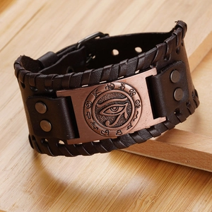 Vintage dark brown leather bracelet featuring bronze Eye of Horus metal plate and studs