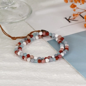 Detail of a handmade double-layer woven bracelet with colorful turquoise beads in retro style