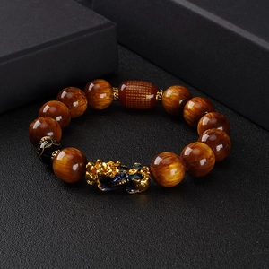 Natural yellow tiger eye bracelet with golden PiXiu charm and red engraved bead