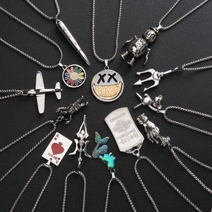 Hip hop titanium steel necklace collection featuring diverse metal pendants on black texture