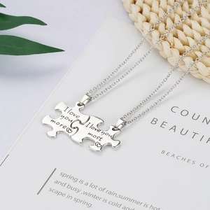 Poliert silberne Puzzle-Halsketten für Paare mit I love you more und most Gravur