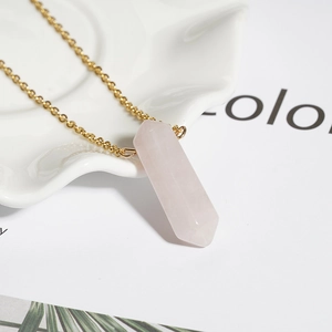 Minimalist gold plated titanium necklace with light pink hexagonal crystal column pendant