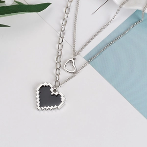 Double-layered silver necklace with pixel art black heart and hollow heart charms