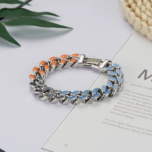 Punk style Cuban link bracelet with tricolor enamel on silver metal laid on magazine