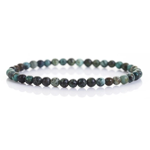 Macro detail of 6mm natural African turquoise beads with unique mottled textures and patterns